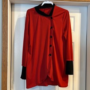 Longer light jacket with ribbed black cuffs, reddish orange color, size 12.